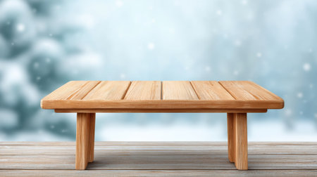 A beautiful wooden table set against a dreamy snowy background creates an inviting atmosphere for seasonal displays and product photography. Perfect for cozy settings.の素材