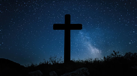 A cross silhouetted against the night sky, with stars twinkling in the background, symbolizing hope and faith in the darkness.の素材