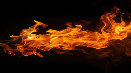 ntense image of a blazing fire in vivid orange and yellow hues against a deep black backdrop, illustrating heat and powerの素材