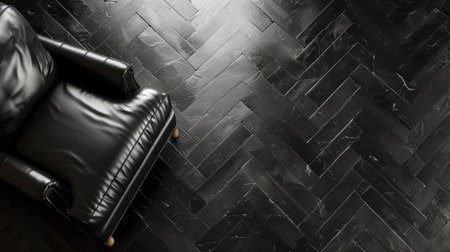 A floor covered in black tiles with a subtle herringbone pattern, offering a classic and sophisticated styleの素材