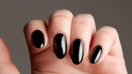 Minimalism meets glamour: Sleek black manicure with a touch of minimalist flair, embodying modern sophistication.の素材