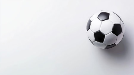 Minimalist soccer-themed banner with a clean white background, featuring a soccer ball ready for the game.の素材