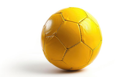 Striking shot of a vibrant yellow soccer ball isolated on a crisp white backgroundの素材