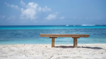 Smooth wooden table placed on a white sandy beach, with the tranquil sea in the background, perfect for showcasing items.の素材