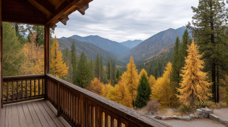 Experience a breathtaking autumn landscape from a cabin deck, showcasing colorful foliage and majestic mountains in a serene wilderness setting. Perfect for nature lovers.の素材