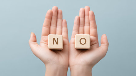 Hands present wooden cubes marked with "yes" and "no," illustrating clarity in decision-making. A minimalistic design enhances the concept of choices and communication.の素材