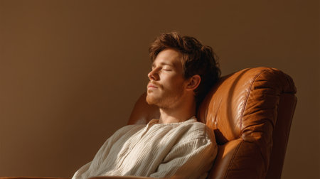 A peaceful scene depicting an individual resting quietly in a chair, enveloped in warm light. This tranquil setting evokes feelings of serenity and relaxation, perfect for wellness themes.の素材