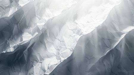 Abstract white textured background with soft light and shadows.の素材