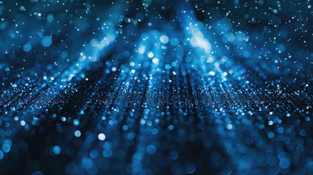Mesmerizing loop of blue glitter particles illuminated by delicate light rays, gently falling in an enchanting patternの素材