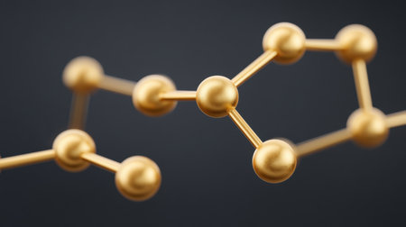 Explore the intricate beauty of golden atomic connections forming a sophisticated molecular network on a glossy black surface, ideal for science and design themes.の素材