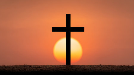 A striking silhouette of a cross framed by a vibrant sunset, embodying themes of faith, hope, and spirituality. This beautiful image captures the essence of tranquility.の素材