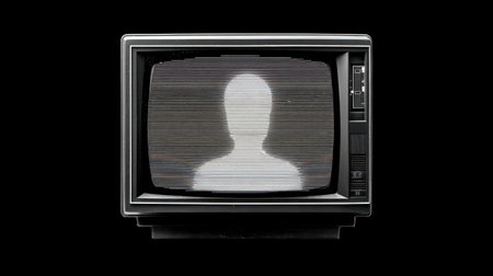 A vintage television set displaying static with a faint human silhouette, symbolizing isolation and mystery. Ideal for creative projects and media expressions.の素材