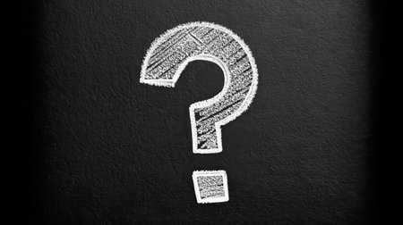 This image features a large question mark drawn in chalk on a blackboard background, symbolizing uncertainty and curiosity, perfect for conceptual designs and educational themes.の素材