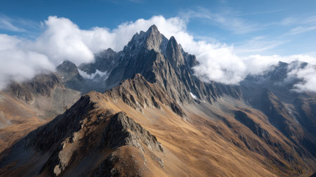 Experience the breathtaking beauty of a mountain landscape, showcasing rolling clouds over majestic peaks and dramatic rocky terrains. Perfect for nature enthusiasts.の素材
