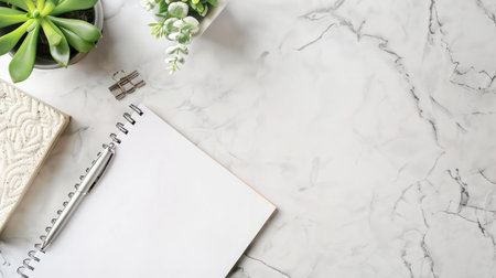 Minimalist office setup with a blank notepad and penの素材