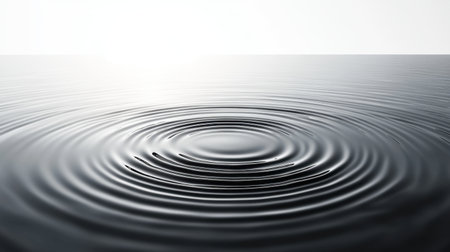 Abstract black and white pattern in water, viewed from above as ripples distort the shapes under a clear, sunny sky.の素材
