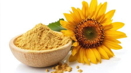 Yellow lecithin powder from sunflower sits on white background with a vibrant bloom subtly in the backdropの素材
