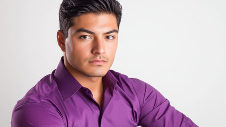 A portrait of an adult Hispanic man dressed in a sharp purple shirt, showcasing confidence and charisma against a clean white backdrop, perfect for promotional useの素材