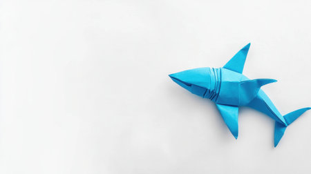 This vibrant blue origami shark adds a playful touch to any project. Its unique paper design showcases creativity and skill in crafting. Perfect for marine-themed decor.の素材