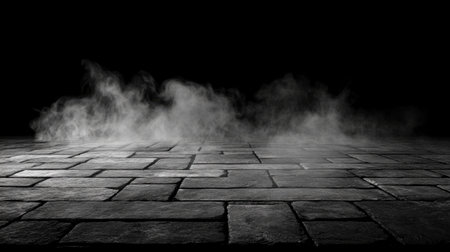 A dark stone floor covered in gentle wisps of fog creates an atmospheric setting, perfect for adding mystery and intrigue to artistic and creative projects.の素材