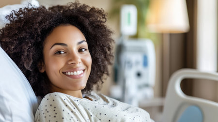 A joyful young woman with curly hair lies in a hospital bed, radiating positivity while receiving care and support during her recovery journey in a serene and warm atmosphere.の素材