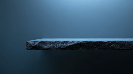 A minimalist display surface with a textured edge illuminated by soft blue light, perfect for product presentations, photography, and modern interior design concepts.の素材