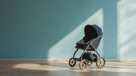 A sleek baby stroller positioned in a serene, minimal space, showcasing modern design elements against a soothing blue wall, perfect for family life and stylish parenting.の素材