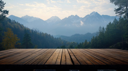 A stunning view of distant mountains captured from a wooden deck, surrounded by lush trees under a clear blue sky, inviting exploration and tranquility.の素材