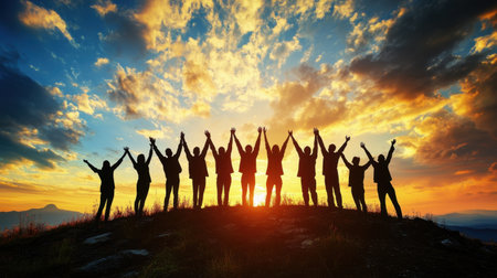 A joyful group of individuals silhouetted against a vibrant sunset, raising their hands in celebration. The scene captures emotions of unity and freedom, showcasing the beauty of nature.の素材