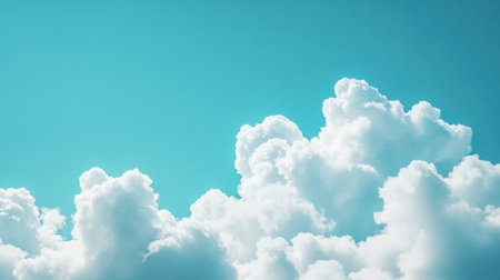 A breathtaking scene of white fluffy clouds floating against a clear blue sky, creating a serene atmosphere perfect for relaxation and inspiration.の素材