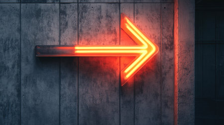 A vibrant neon arrow sign glowing against a textured concrete wall, serving as a striking directional indicator in an urban environment, perfect for modern design themes.の素材