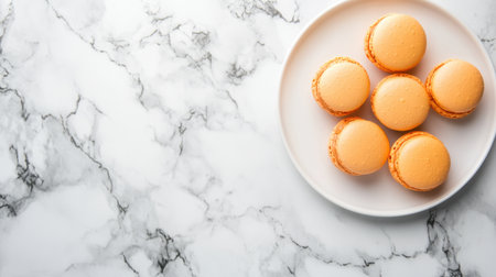 A delightful arrangement of fresh orange macarons on a sleek marble plate, perfect for dessert tables and afternoon gatherings, embodying elegance and taste.の素材