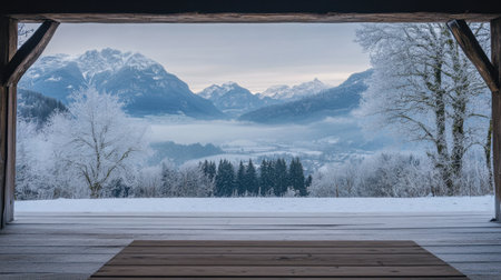 Stunning winter landscape featuring snow-covered mountains, a frosty valley, and a peaceful view through a wooden frame. Perfect for nature lovers and travel enthusiasts.の素材