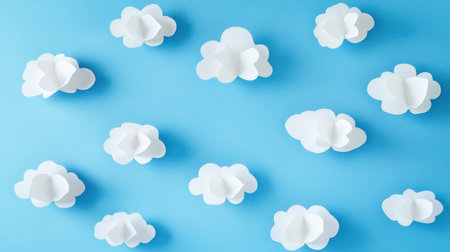 Delightful paper clouds float against a serene blue backdrop, perfect for creative projects. Ideal for design, marketing, and artistic themes.の素材