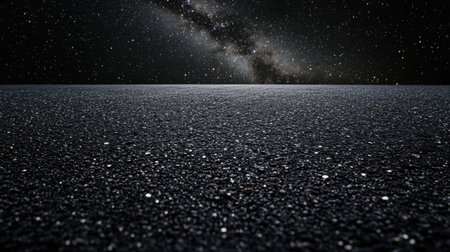 Breathtaking view of a dark ocean surface reflecting a stunning star-filled night sky, showcasing the vastness of the universe and serene tranquility.の素材
