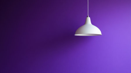 A white pendant lamp gracefully hangs against a vibrant purple wall, creating a striking contrast perfect for modern interiors. Ideal for design inspiration.の素材