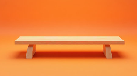Wooden table on a vibrant orange background, perfect for showcasing products with a warm and inviting atmosphere.の素材