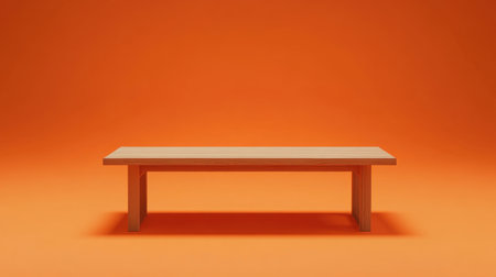 Wooden table on a vibrant orange background, perfect for showcasing products with a warm and inviting atmosphere.の素材
