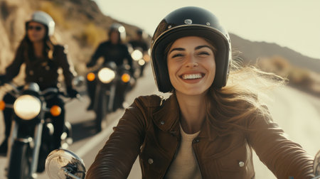 A confident motorcyclist rides with a group on a winding road, her relaxed posture and smile showcasing freedom and thrillの素材