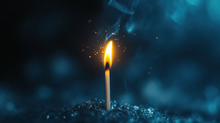 Matchstick ablaze, its flickering flame standing out vividly against the dark, symbolizing ideas coming to life.の素材
