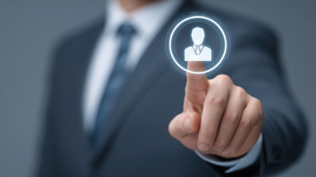 A professional businessman touches a digital CV icon using a magnifying glass symbolizing job reviews and career development in a modern workplace setting.の素材