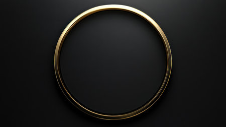 A sleek and elegant gold circular frame positioned against a dark backdrop, perfect for showcasing photography or decorative art in a modern interior setting.の素材