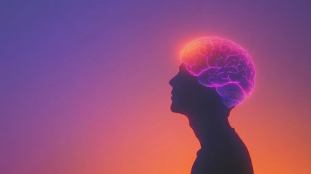 A striking illustration of a colorful brain above a silhouette, symbolizing creativity and thought. The vibrant gradient enhances the artistic representation of mental energy.の素材