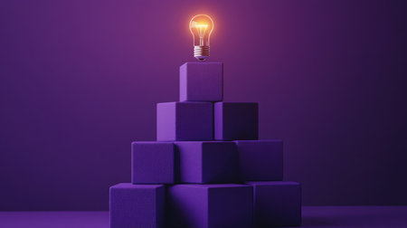 Purple blocks forming a pyramid with a lit bulb above, representing progress and learning growthの素材