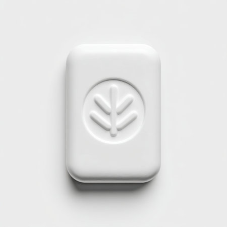 Elegant white soap bar with a unique leaf imprint, perfect for spa and wellness themes. Ideal for product photography, hygiene, and self-care promotions.の素材