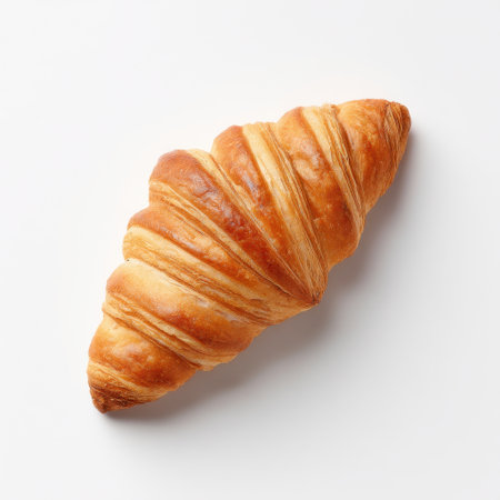A beautifully crafted croissant showcasing its golden, flaky layers, ideal for breakfast or as a delicious snack. Perfect for culinary inspirations and food photography.の素材