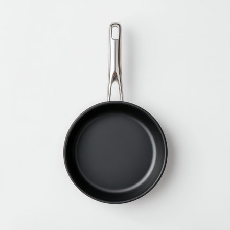 A modern non-stick frying pan featuring a sleek stainless steel handle, perfect for cooking enthusiasts and food photographers looking for elegant kitchenware.の素材
