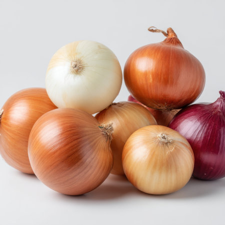 A collection of fresh onions in various colors and sizes, perfect for culinary use. Ideal for food photography, cooking inspiration, and healthy meal preparation.の素材