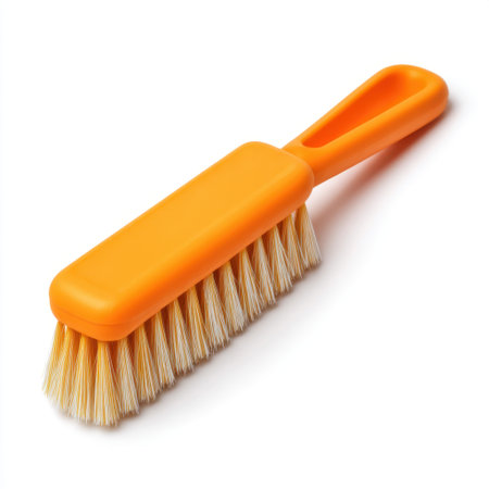 This vibrant orange cleaning brush features soft bristles, perfect for meticulous tasks in grooming and household cleaning. Its minimalist design ensures efficiency and style.の素材