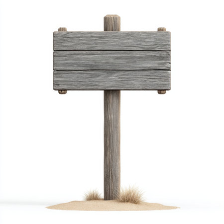 A rustic wooden sign post standing in sand with small grass tufts, offering an empty surface ideal for customization. Perfect for creative projects and promotional uses.の素材